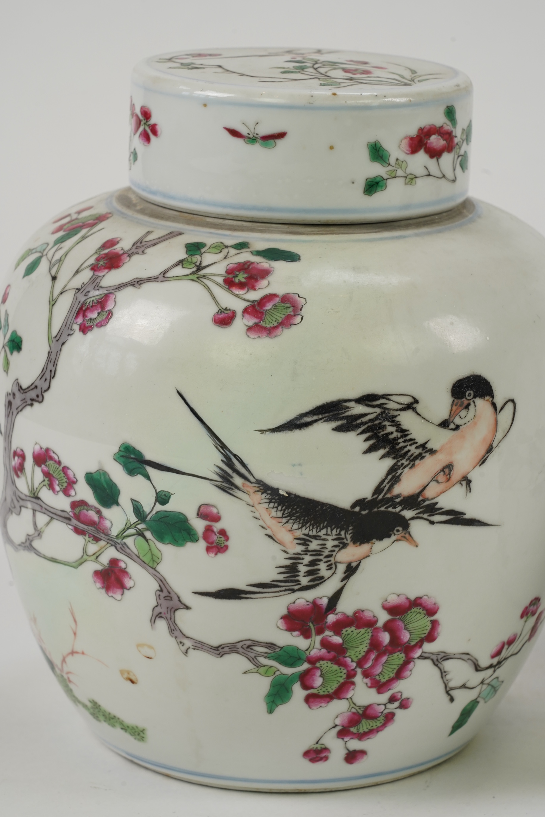 A pair of Chinese famille rose jars and covers, Kangxi mark but late 19th/early 20th century
